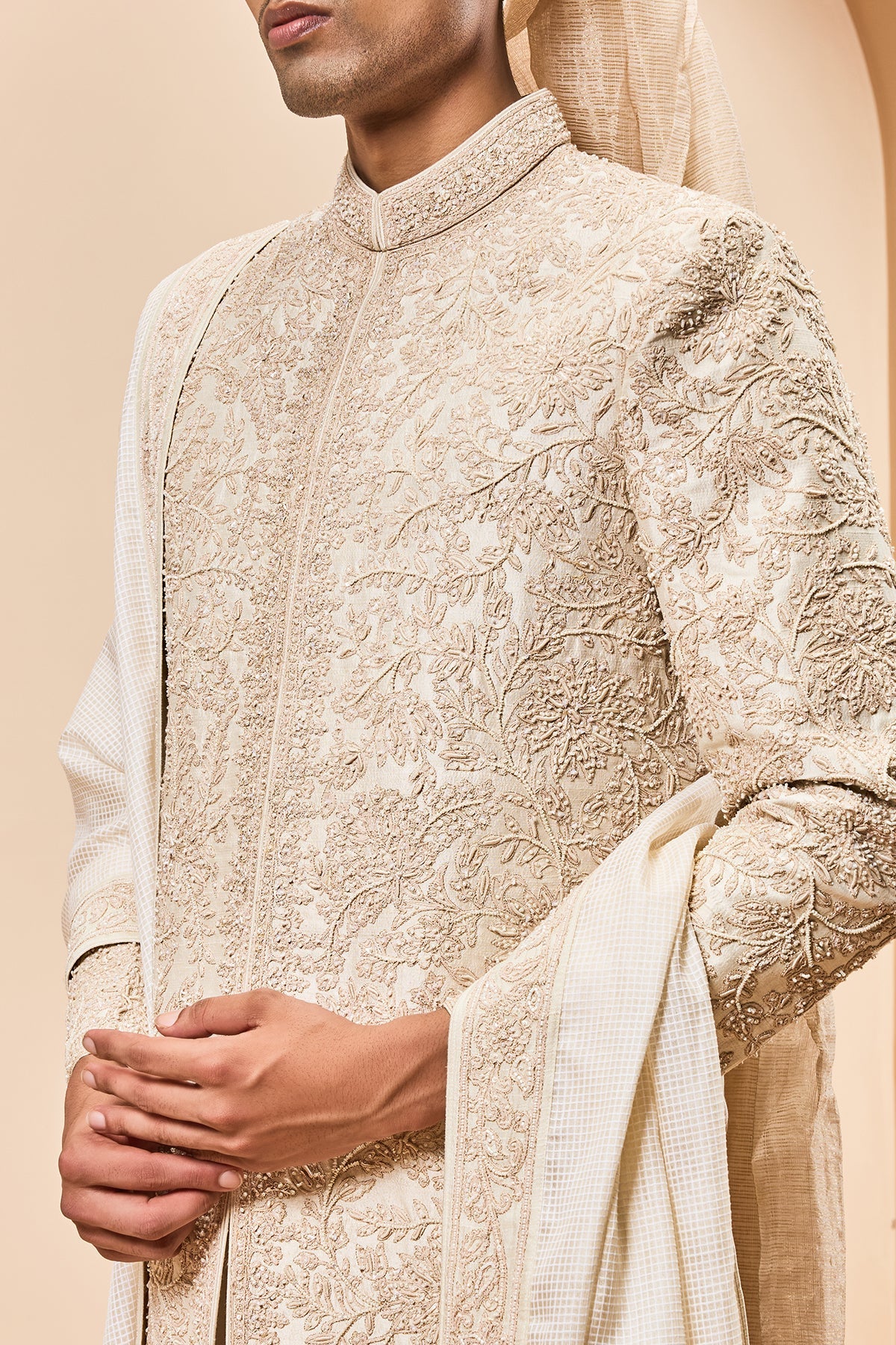 Ivory sherwani detailing with gold zari pearl sequins and spring work