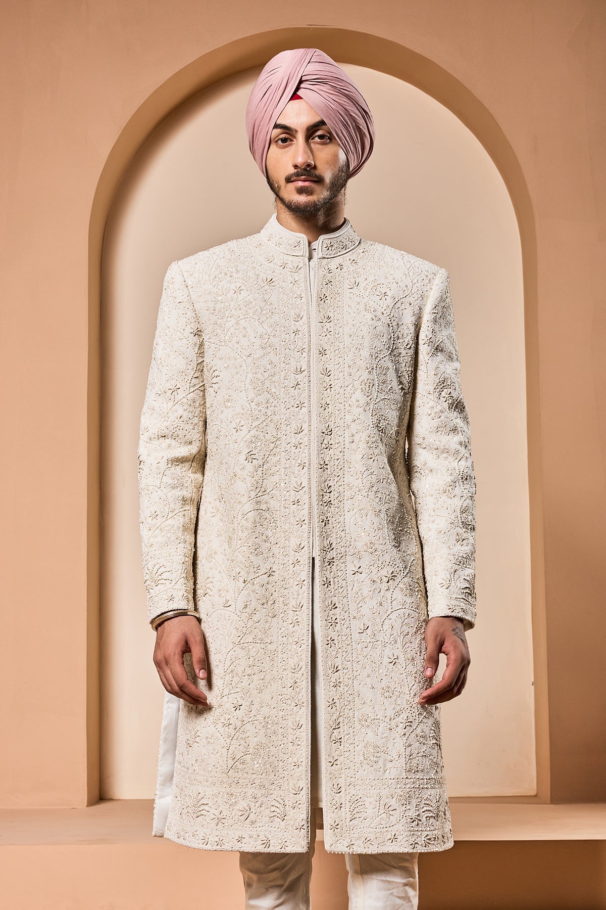 Ivory sherwani detailing with pearl sequins and thread work
