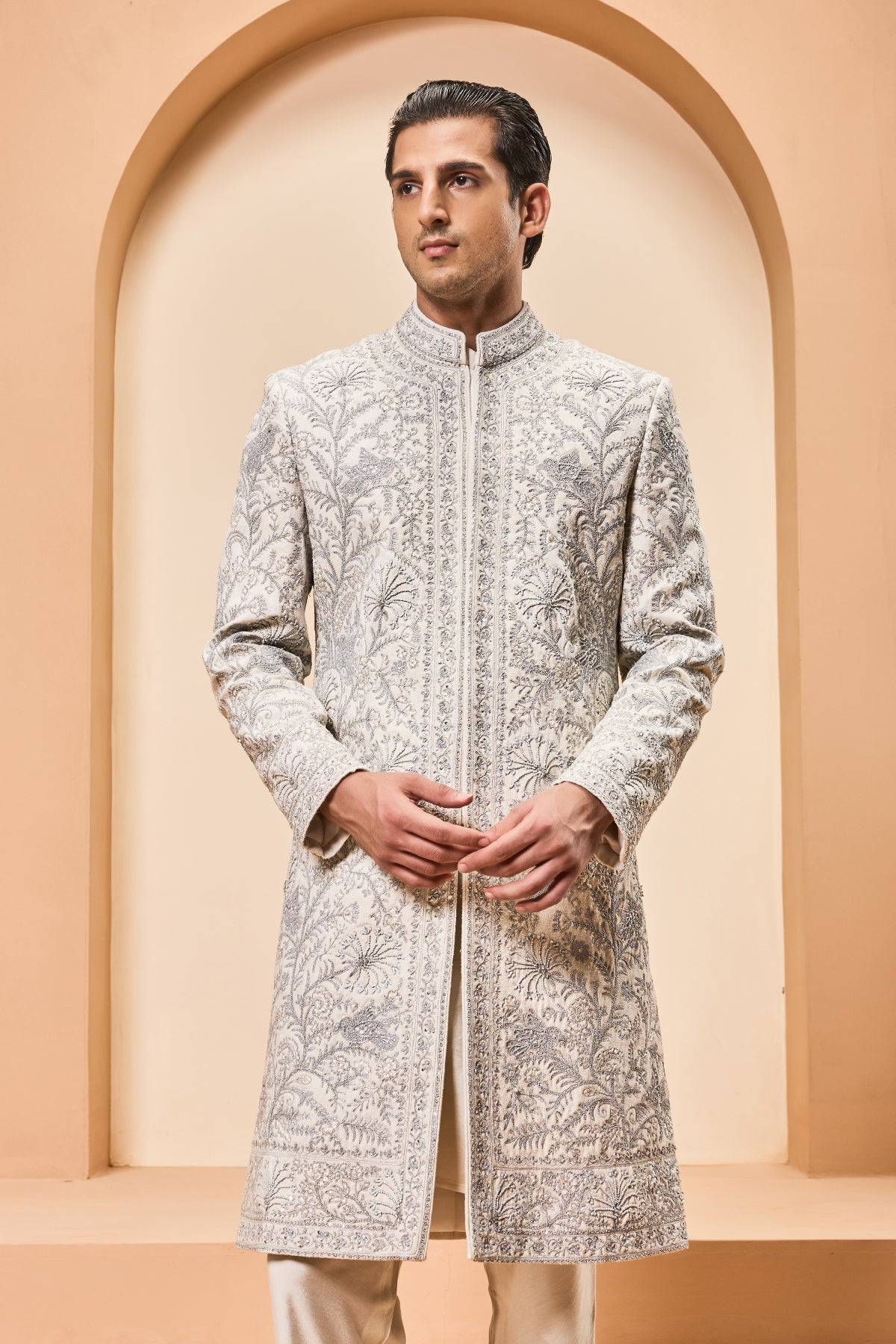 Ivory sherwani detailing with silver zari pearl sequins and thread work