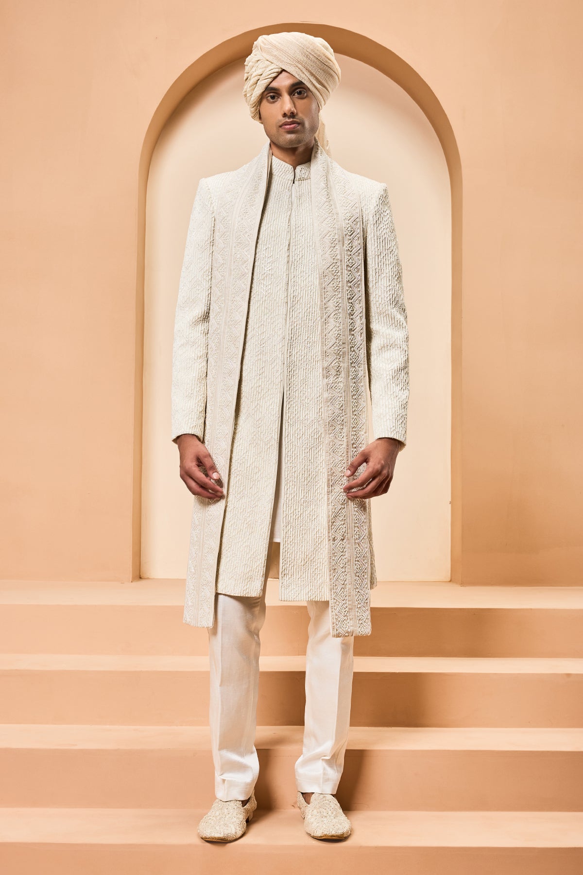 Ivory sherwani detailing with pearl sequins and thread work