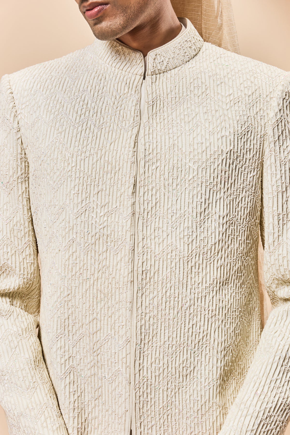 Ivory sherwani detailing with pearl cutdana and pintex work