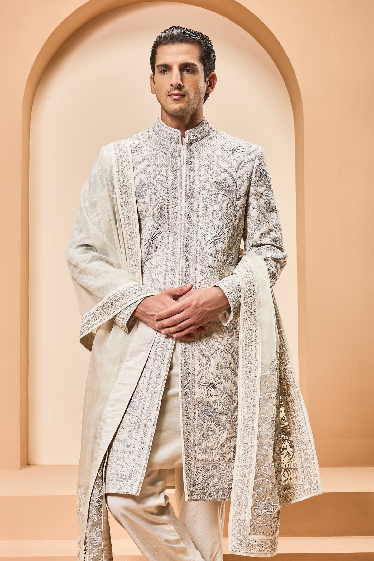 Ivory sherwani detailing with silver zari pearl sequins and thread work