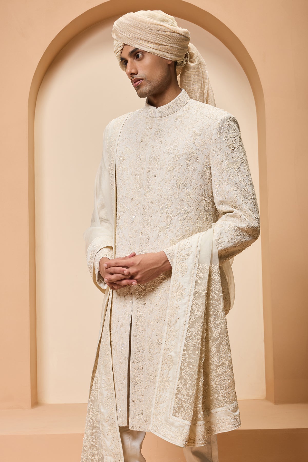 Ivory sherwani detailing with pearl sequins and thread work