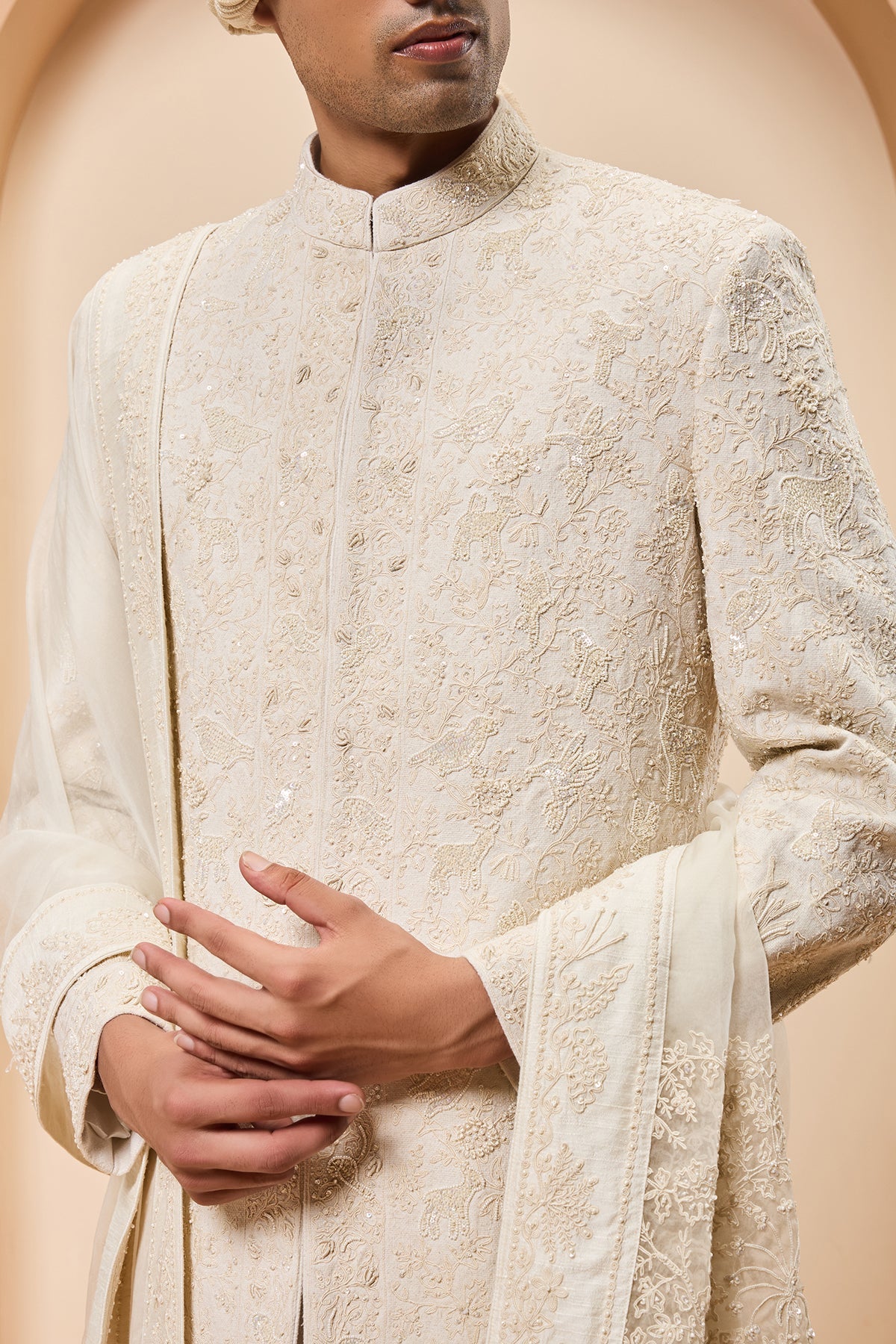 Ivory sherwani detailing with pearl sequins and thread work