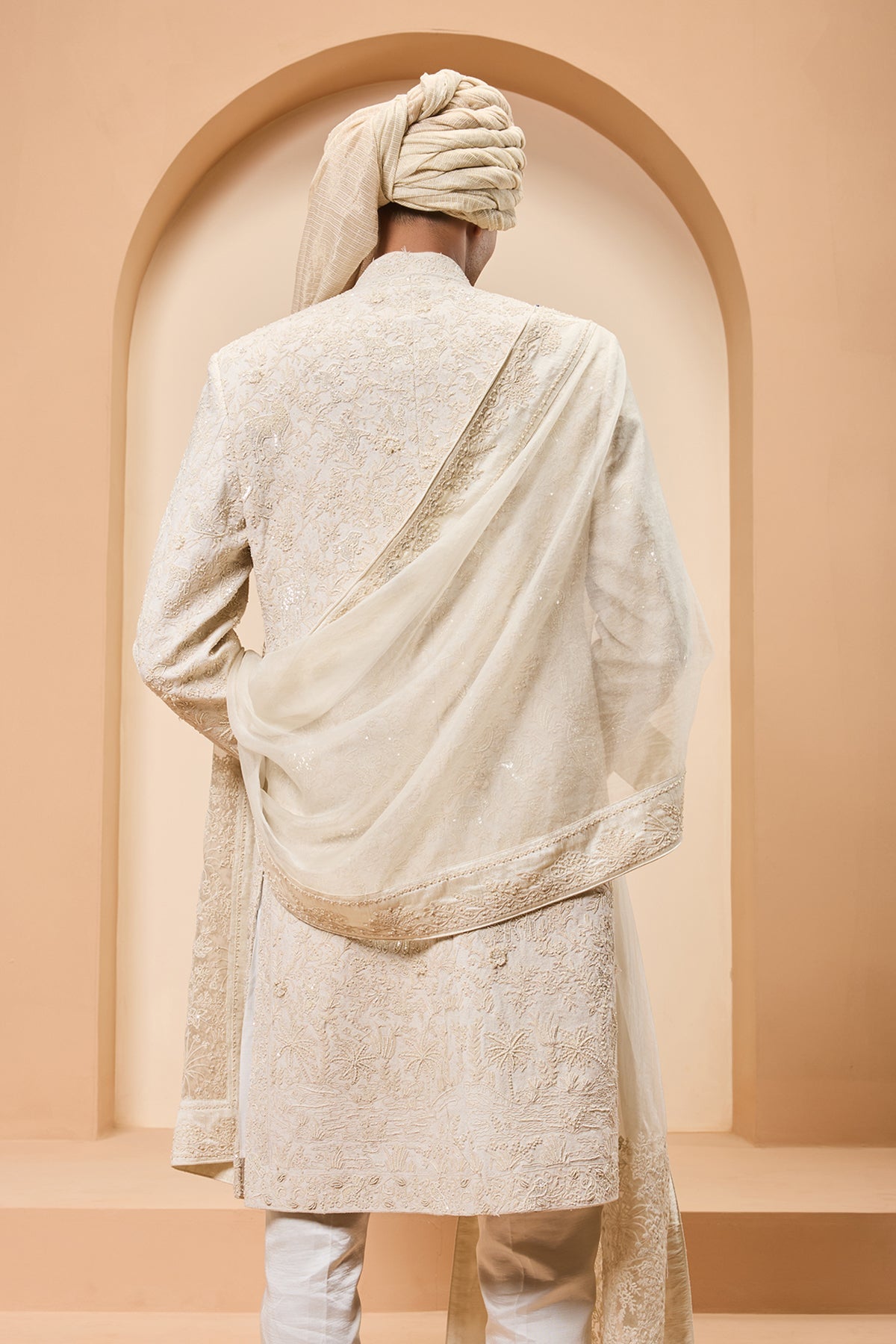 Ivory sherwani detailing with pearl sequins and thread work