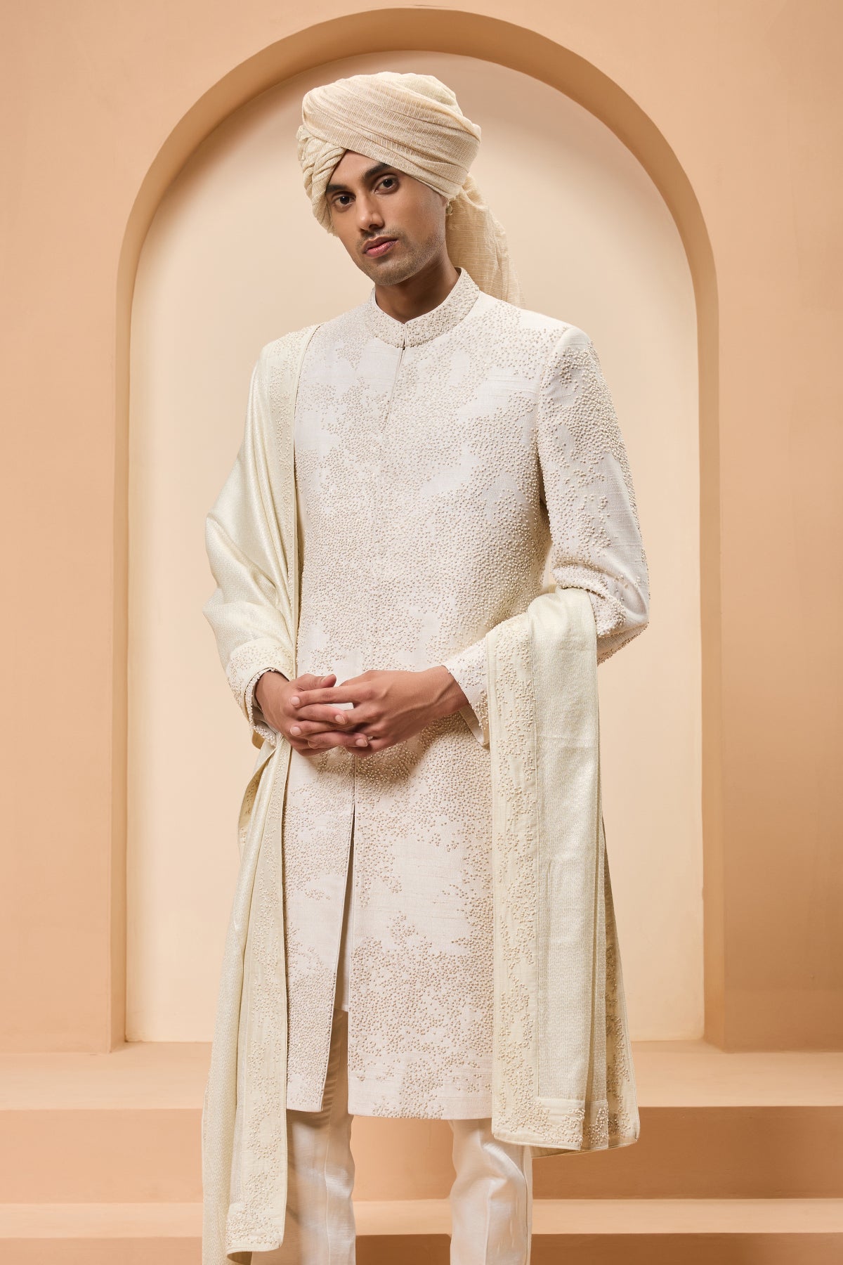 Ivory sherwani detailing with pearl sequins and thread work