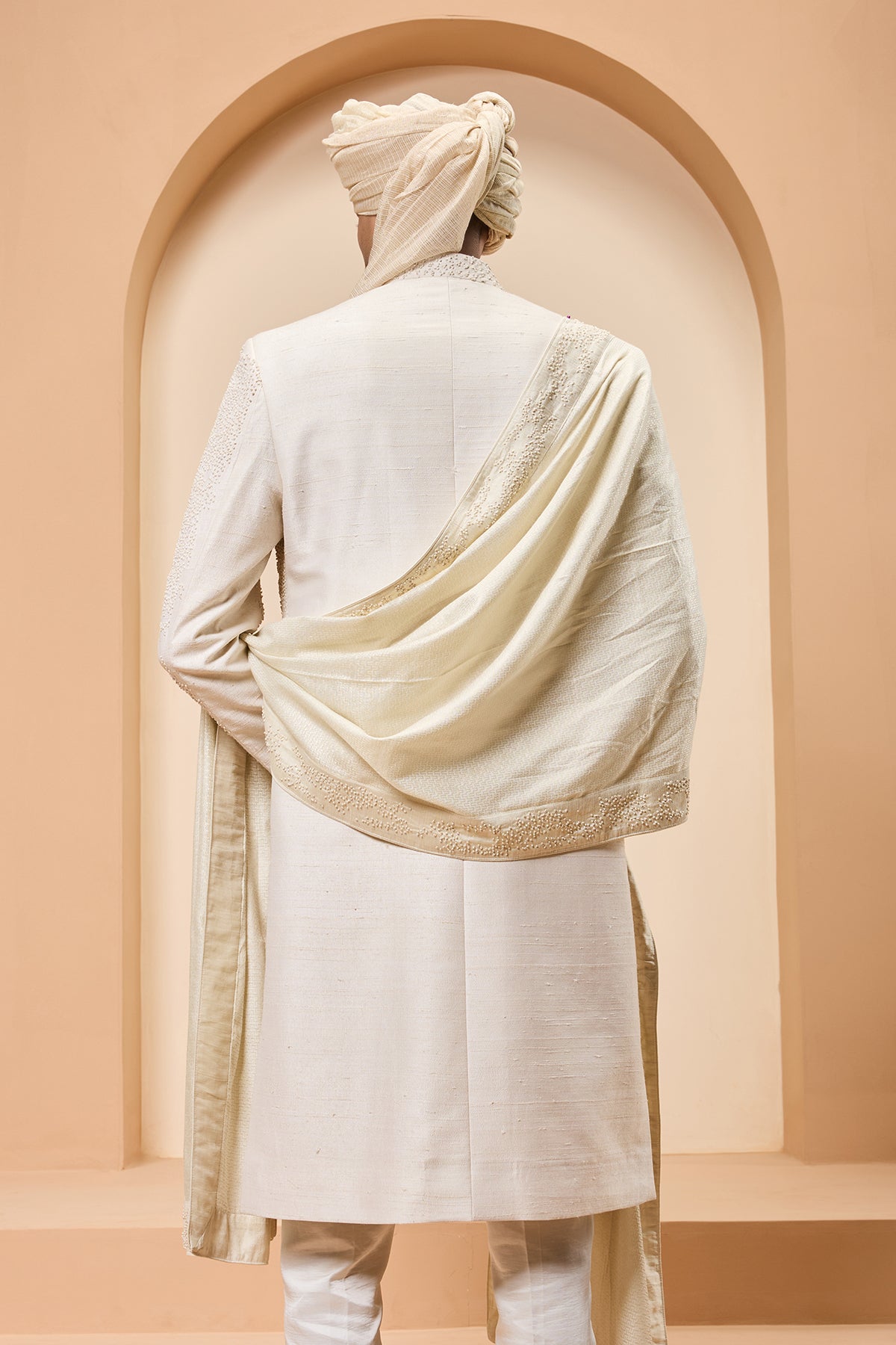 Ivory sherwani detailing with pearl cutdana and thread work