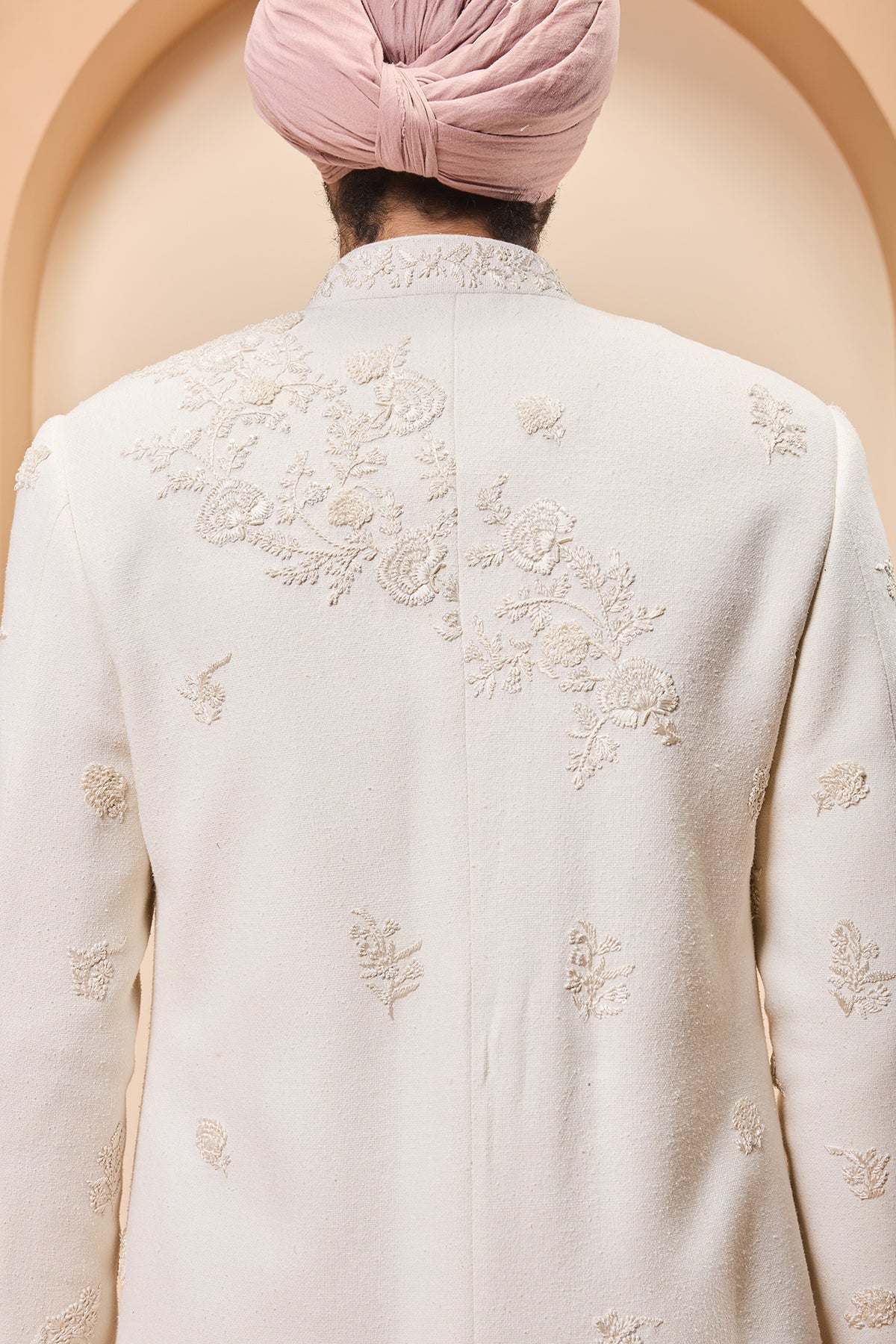 Ivory sherwani detailing with sequins and with thread work
