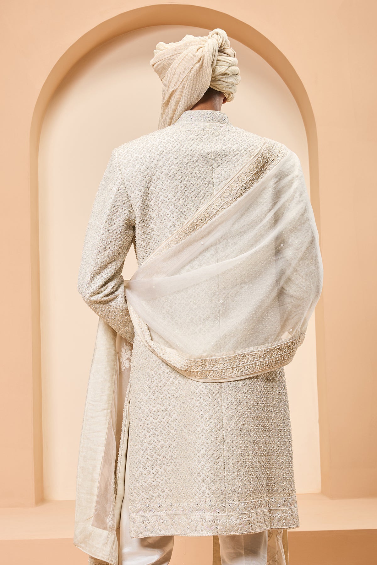 Ivory sherwani detailing with pearl rainbow sequins and thread work