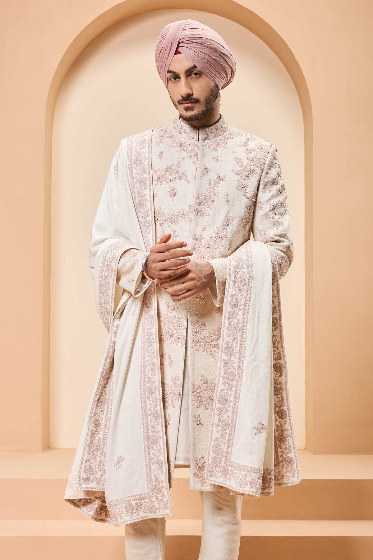 Ivory sherwani detailing with pearl sequins and thread work