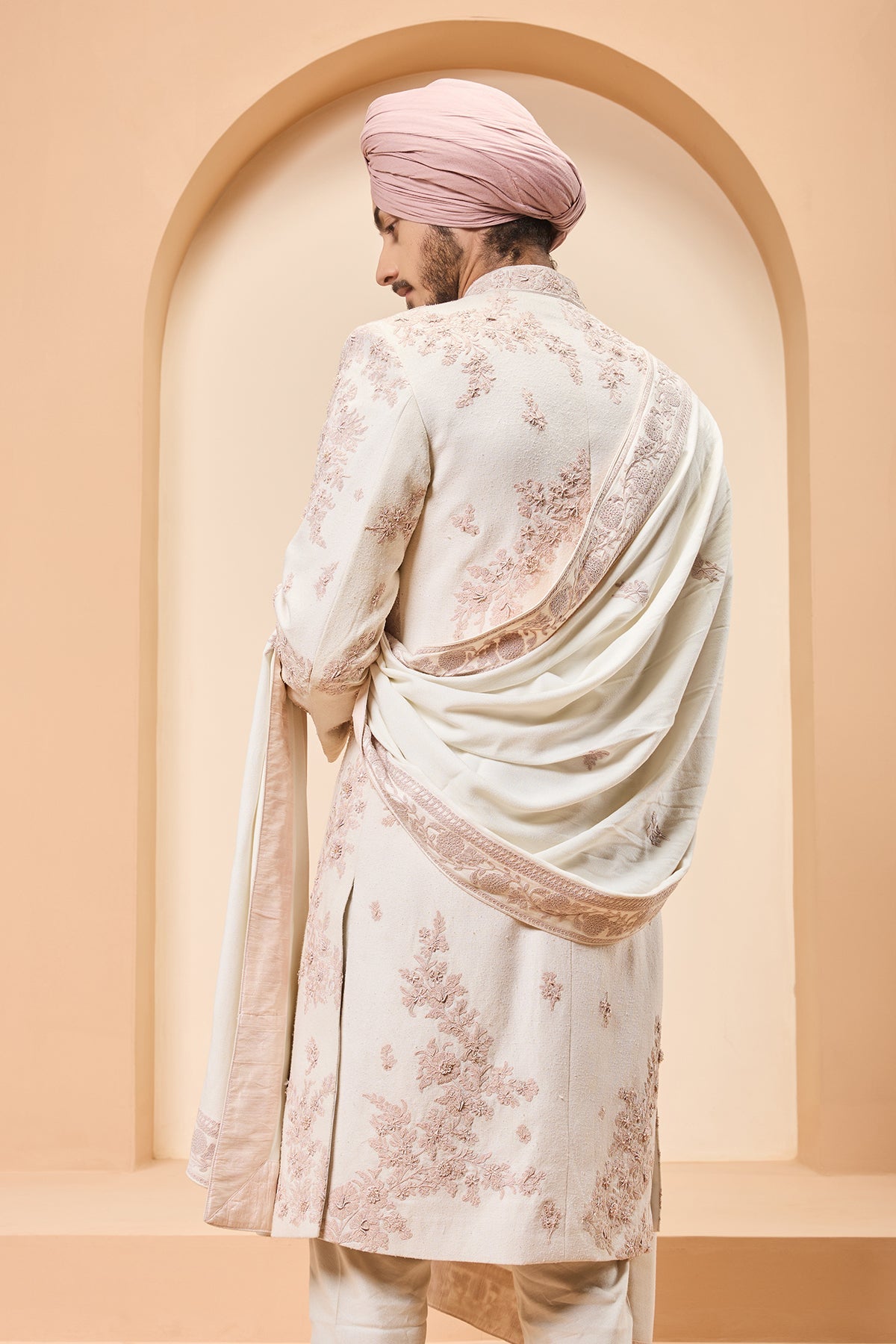 Ivory sherwani detailing with pearl sequins and thread work
