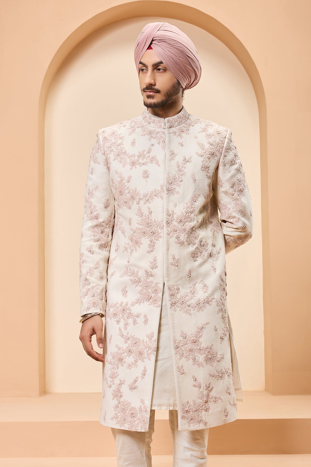 Ivory sherwani detailing with pearl sequins and thread work