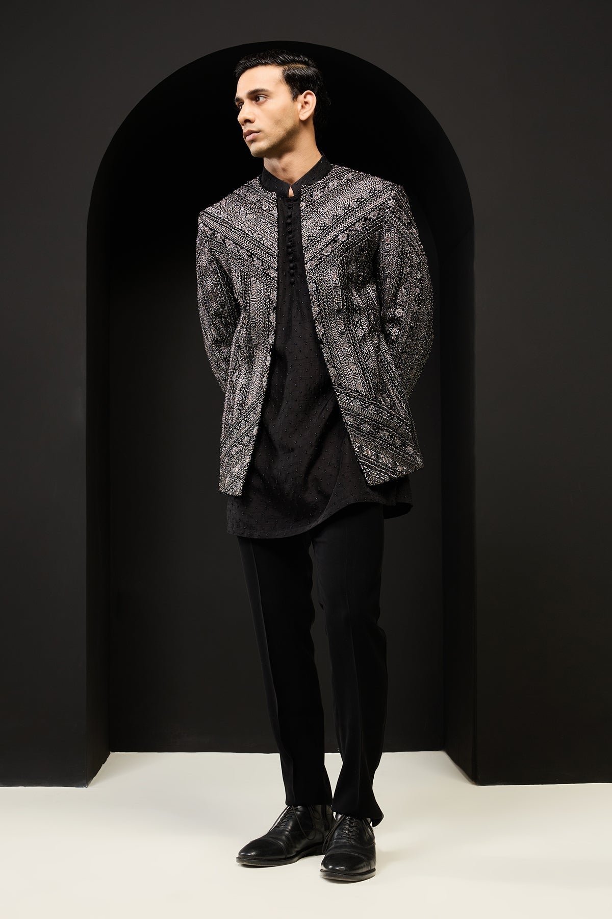 Black open bandhgala 
with silver zari sequins & pearl
work