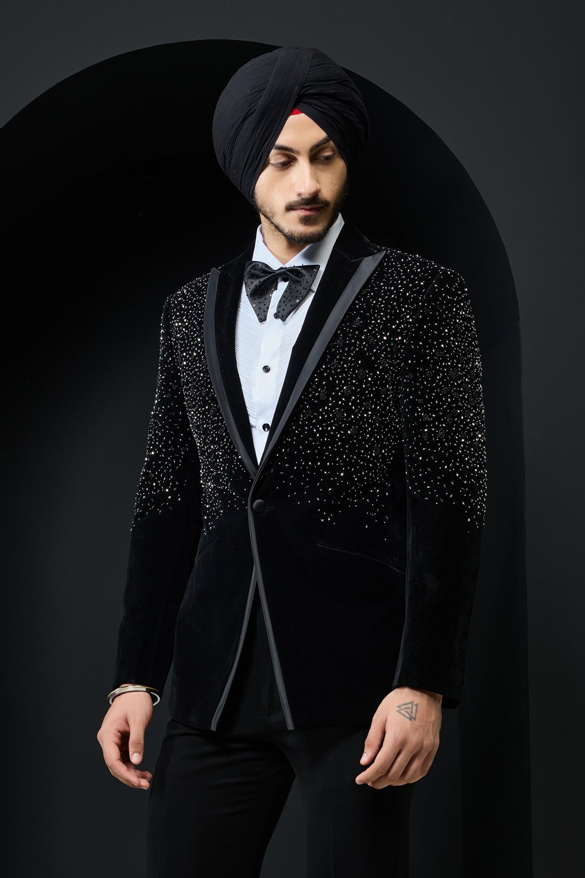 Black tuxedo highlighted with pearls and crystal
