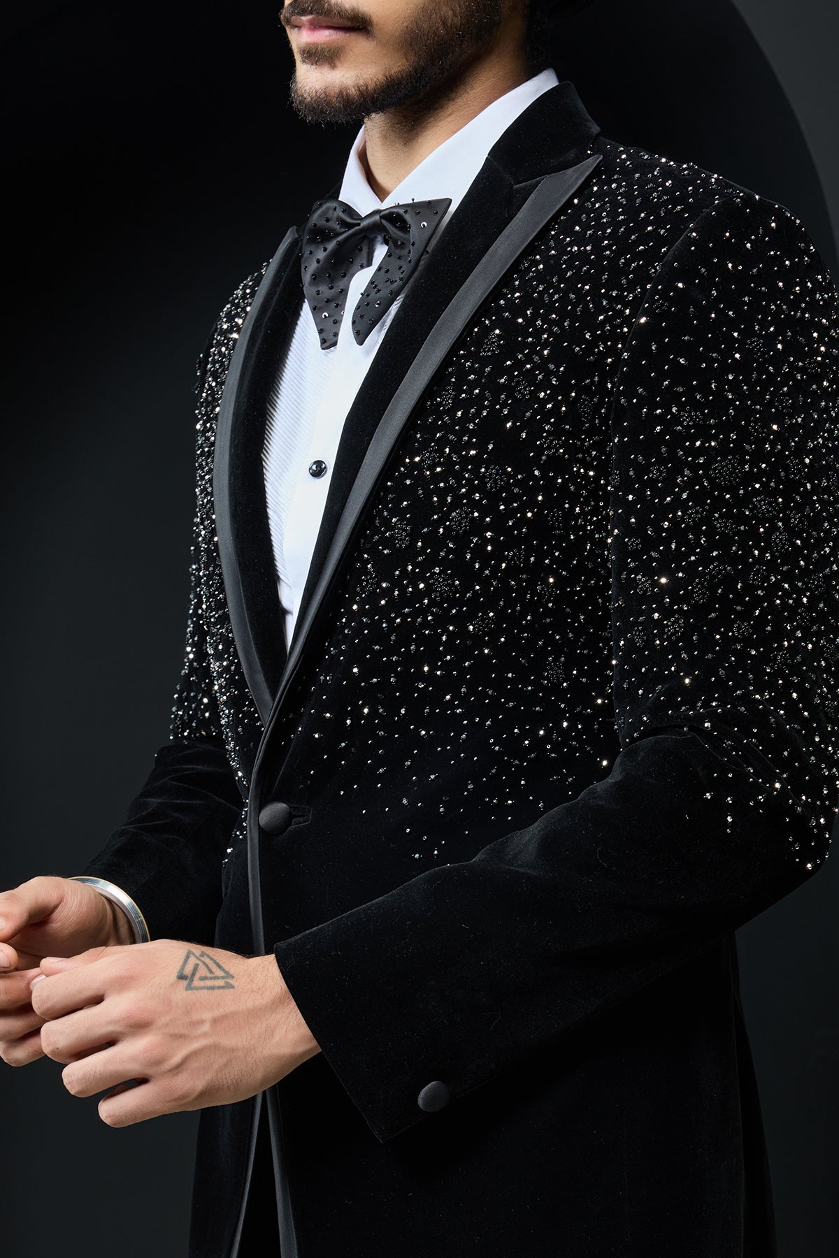 Black tuxedo highlighted with pearls and crystal