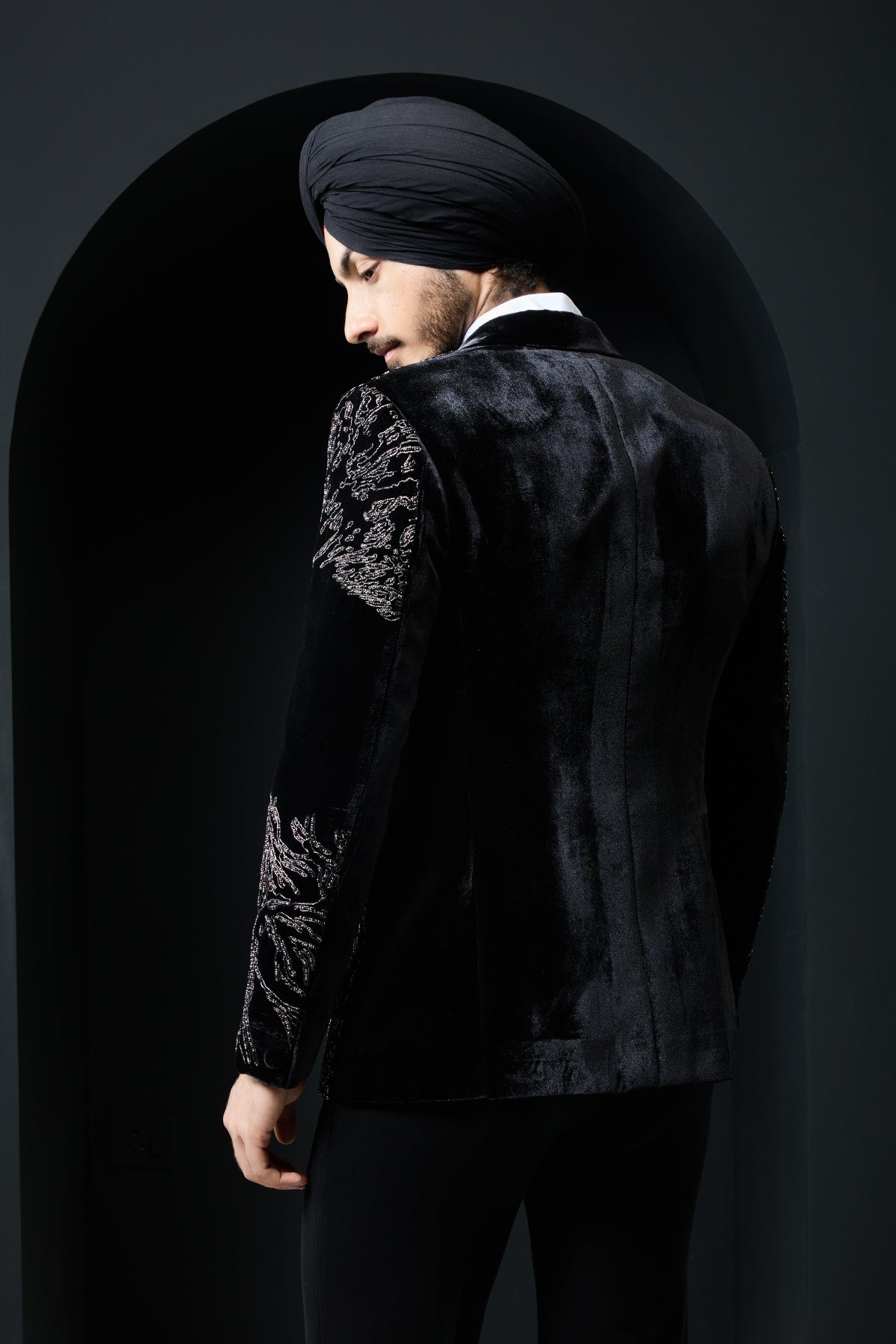 Black tuxedo highlighted with silver zari and peals