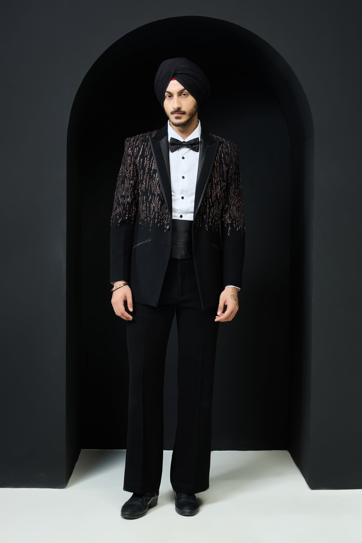 Black tuxedo highlighted with pearls sequins and thread work