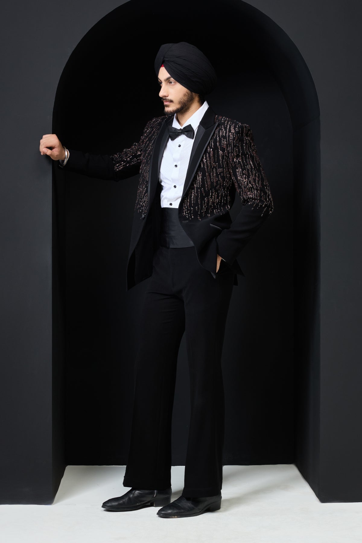 Black tuxedo highlighted with pearls sequins and thread work