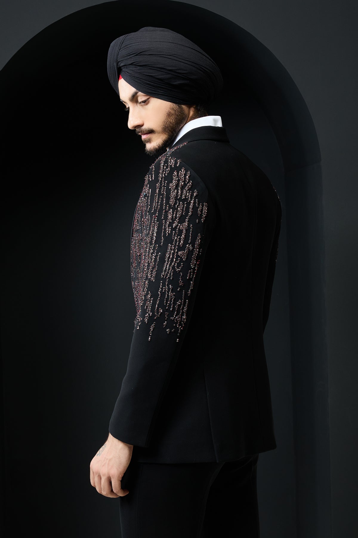 Black tuxedo highlighted with pearls sequins and thread work