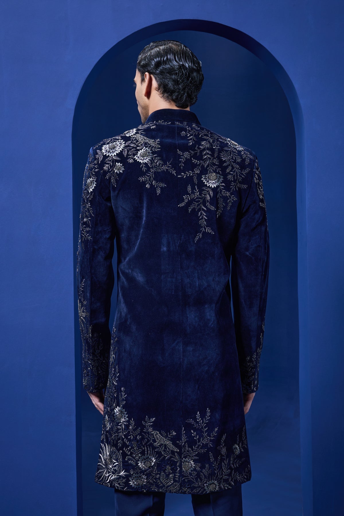 Navy blue Indo Western highlighted with silver zari pearl and cutdana