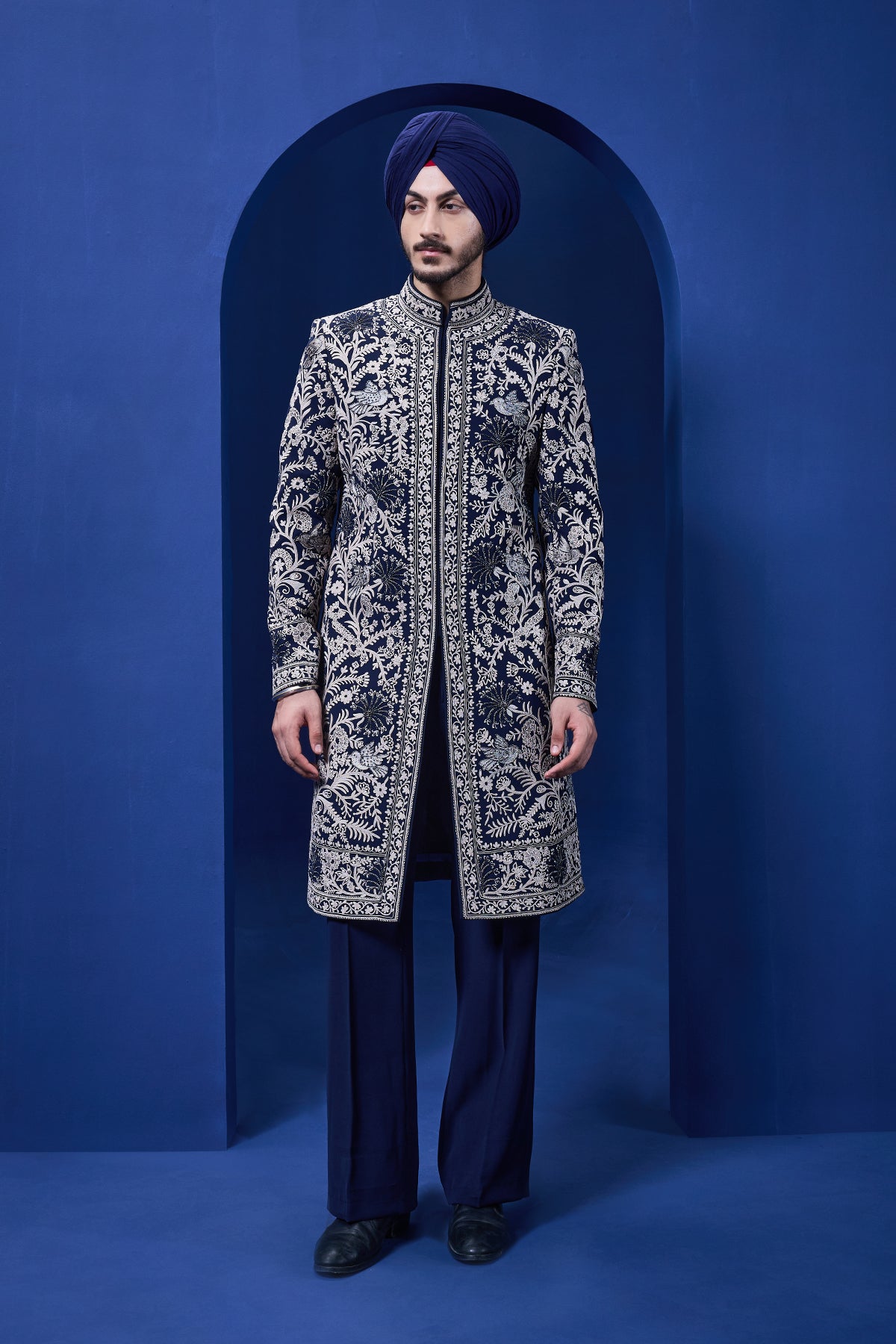 Navy blue Indo Western highlighted with sequins pearls and thread work