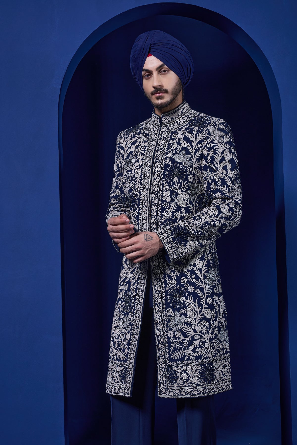 Navy blue Indo Western highlighted with sequins pearls and thread work