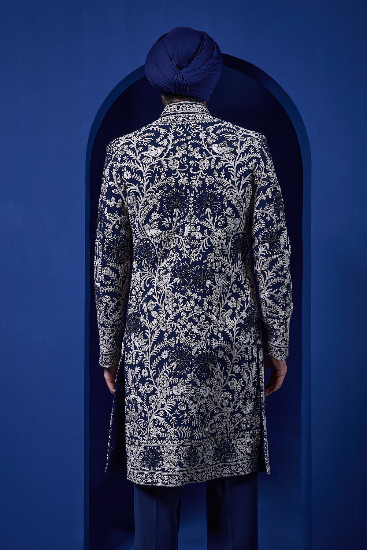 Navy blue Indo Western highlighted with sequins pearls and thread work