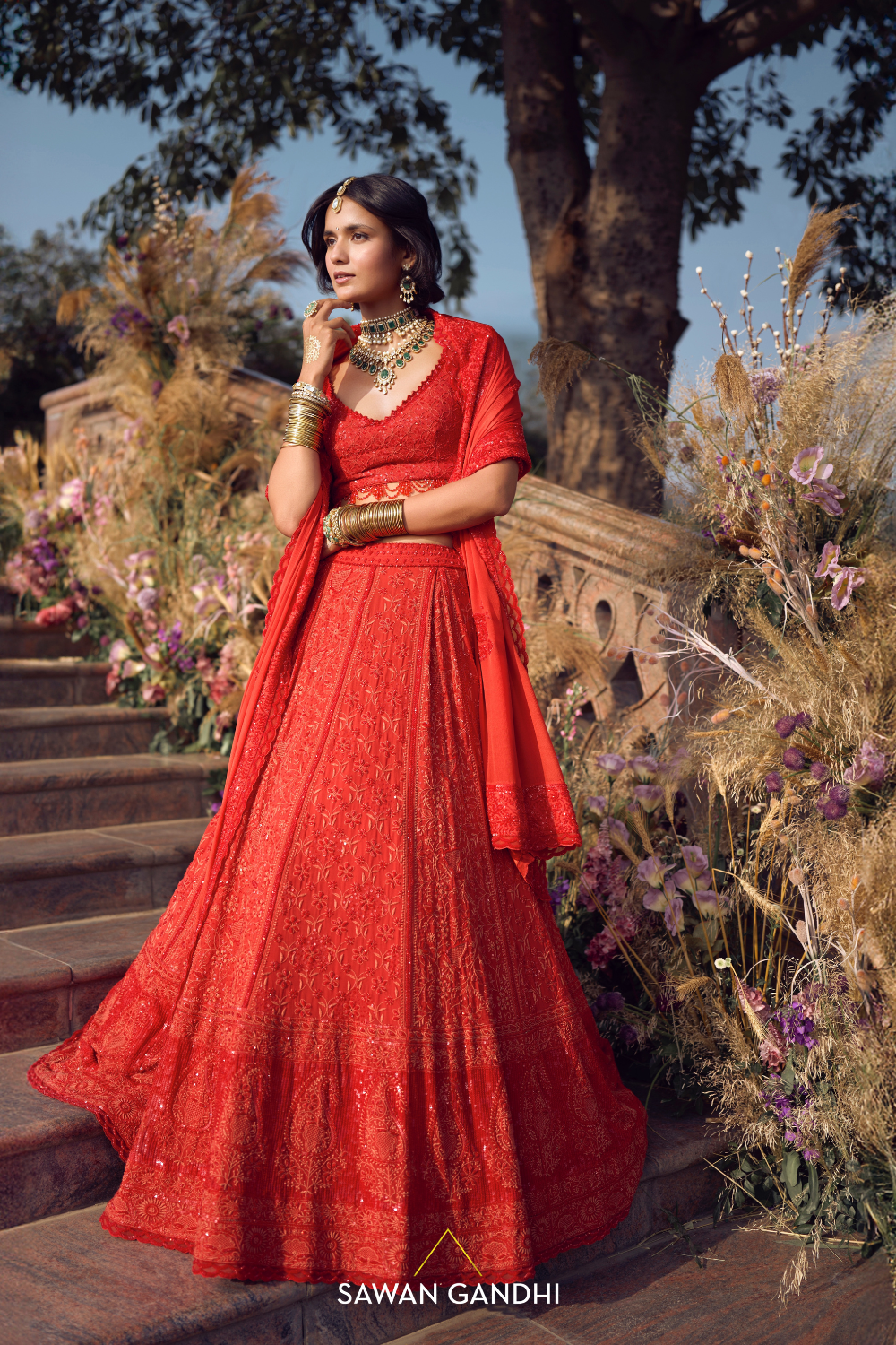 THE ORANGE-RED CHIKANKARI LEHENGA