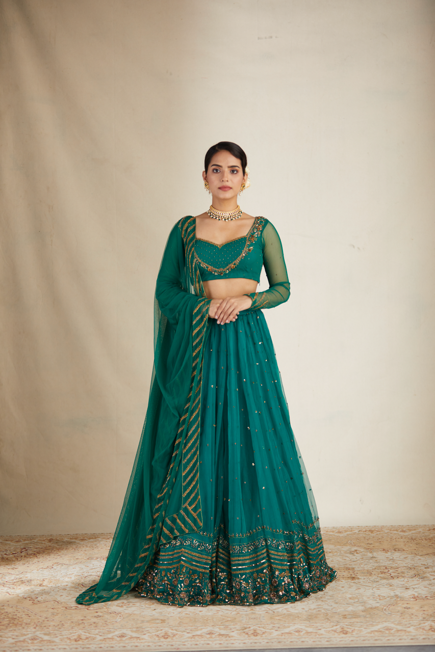 TEAL GREEN ANTIQUE SEQUENCE WORK LEHENGA SET