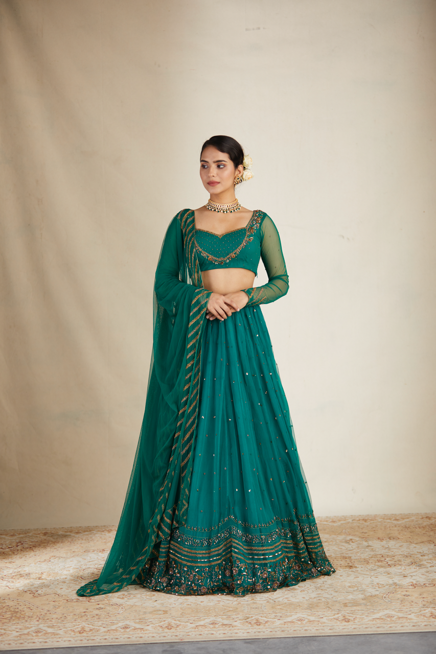 TEAL GREEN ANTIQUE SEQUENCE WORK LEHENGA SET