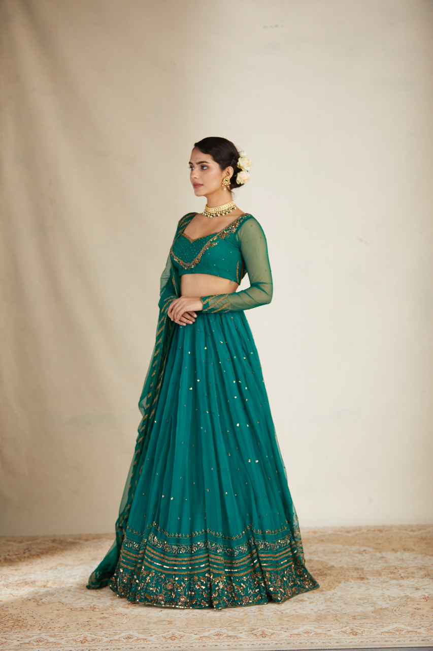 TEAL GREEN ANTIQUE SEQUENCE WORK LEHENGA SET