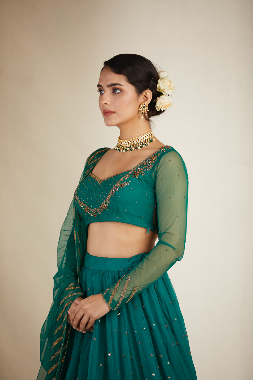 TEAL GREEN ANTIQUE SEQUENCE WORK LEHENGA SET