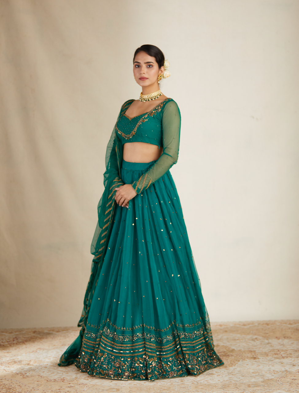 TEAL GREEN ANTIQUE SEQUENCE WORK LEHENGA SET