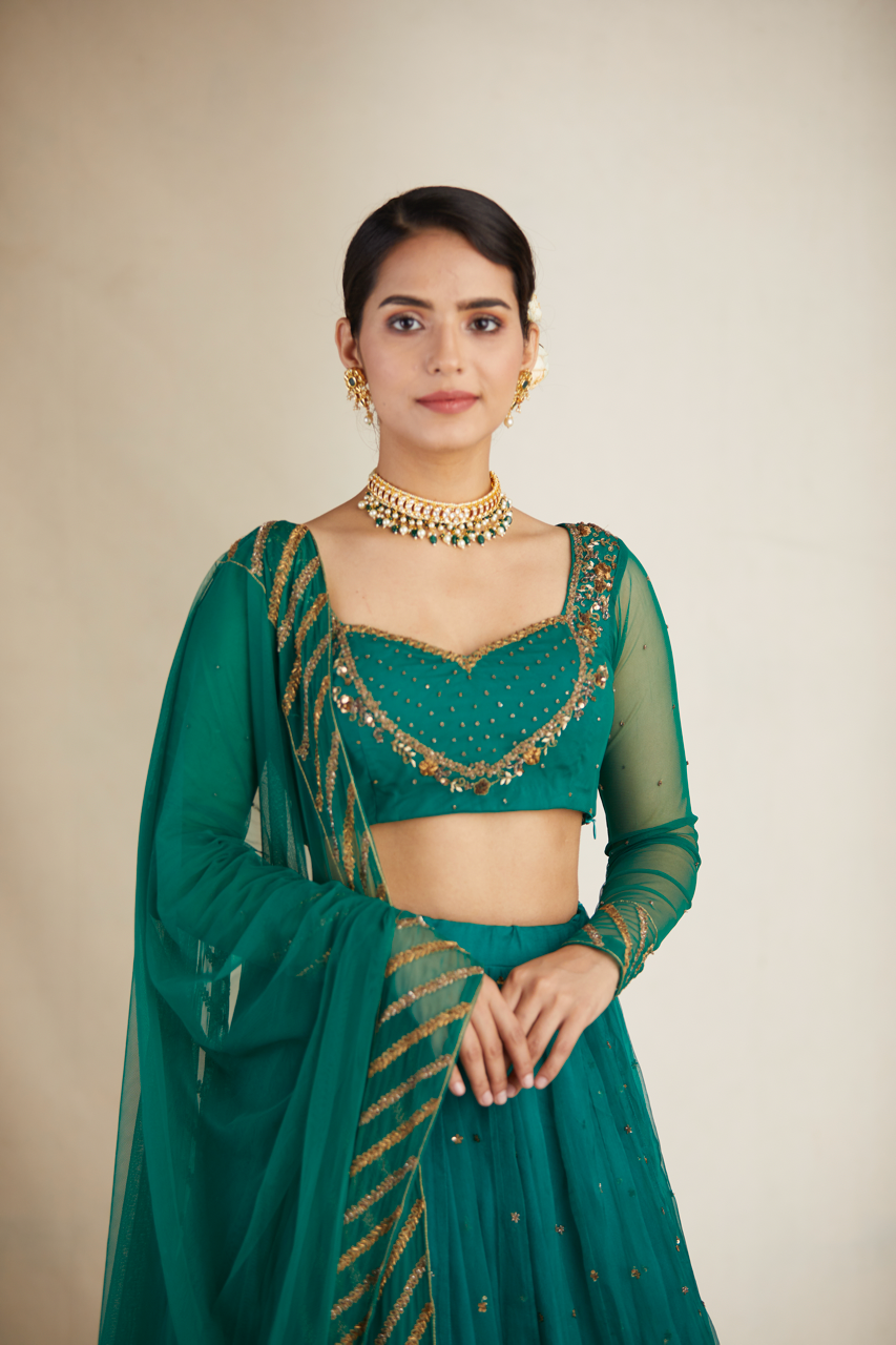TEAL GREEN ANTIQUE SEQUENCE WORK LEHENGA SET