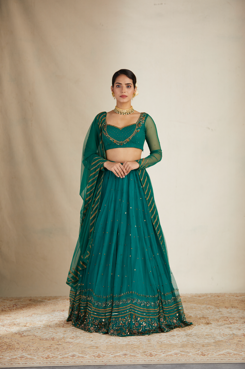 TEAL GREEN ANTIQUE SEQUENCE WORK LEHENGA SET