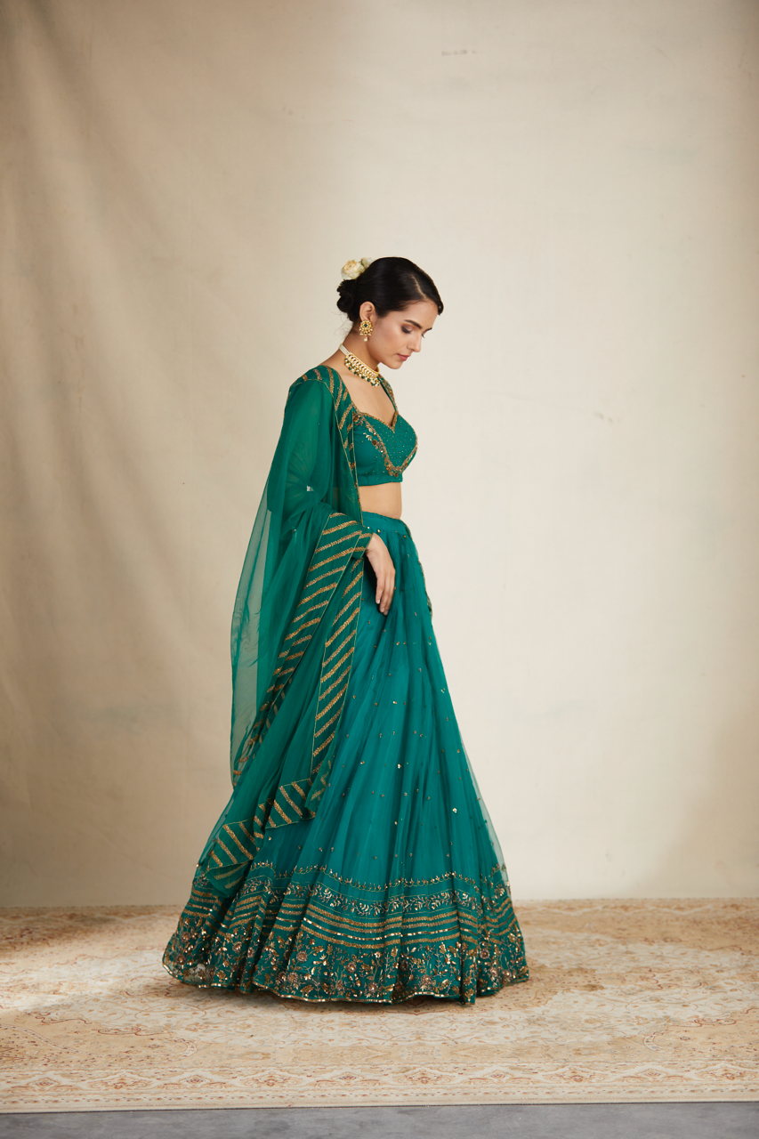 TEAL GREEN ANTIQUE SEQUENCE WORK LEHENGA SET