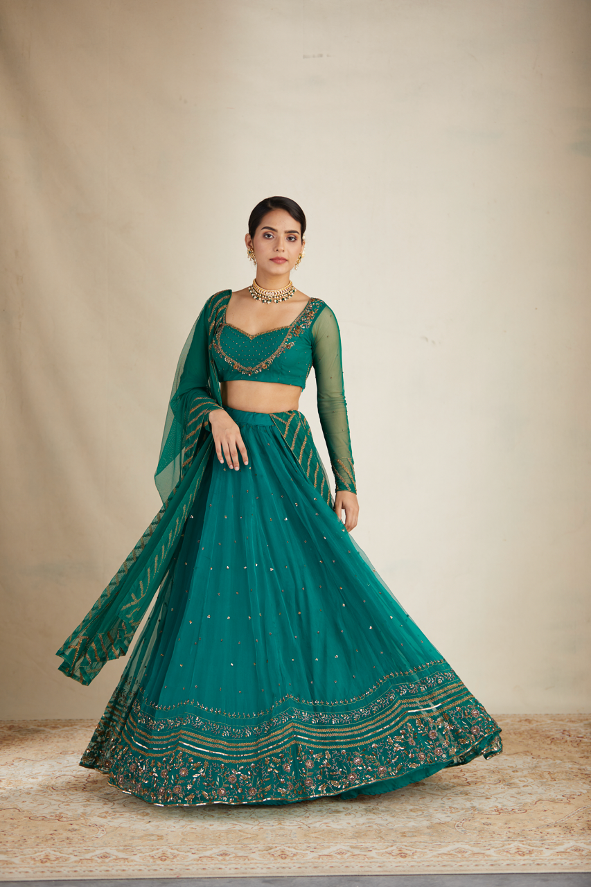 TEAL GREEN ANTIQUE SEQUENCE WORK LEHENGA SET