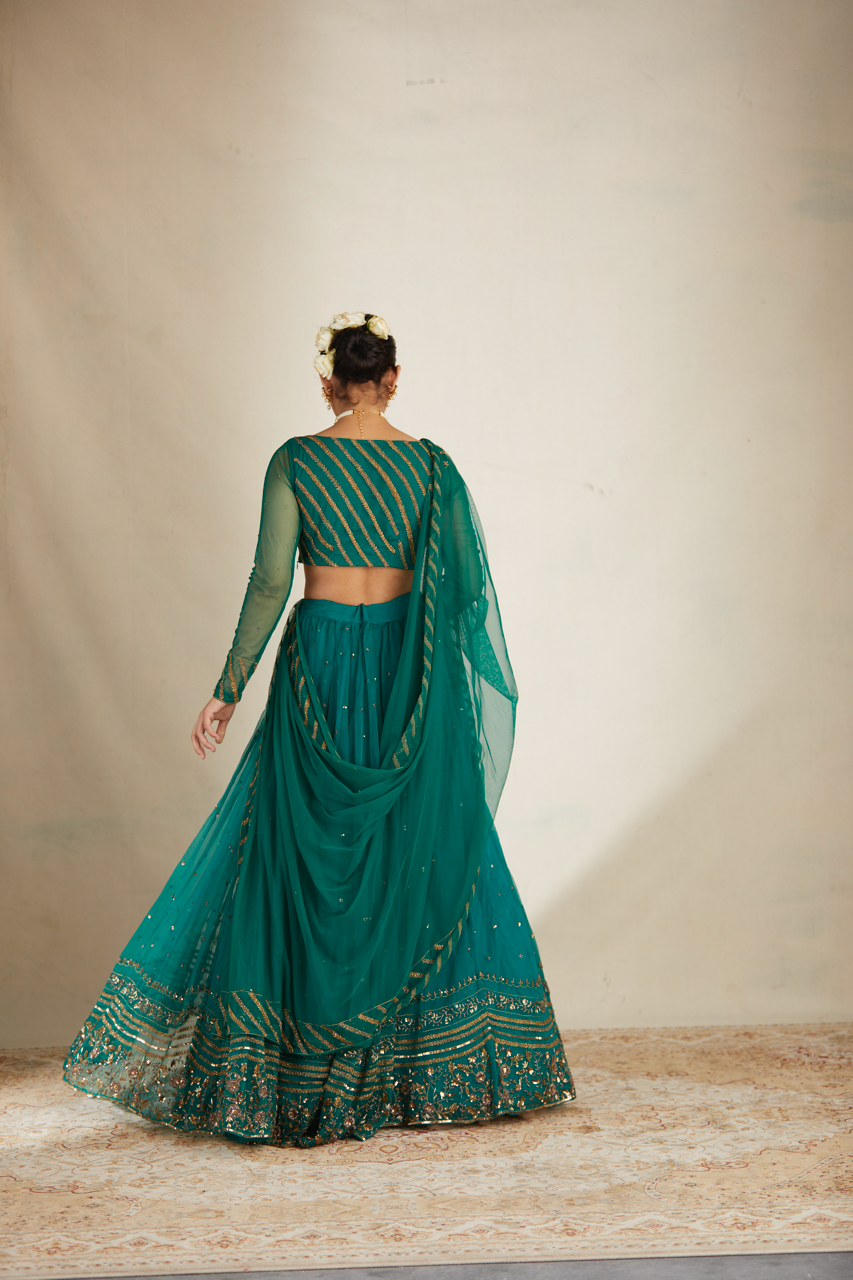 TEAL GREEN ANTIQUE SEQUENCE WORK LEHENGA SET