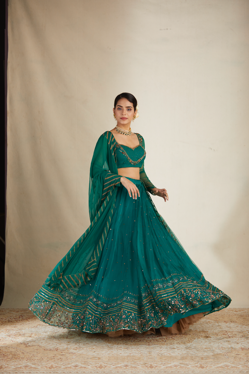 TEAL GREEN ANTIQUE SEQUENCE WORK LEHENGA SET