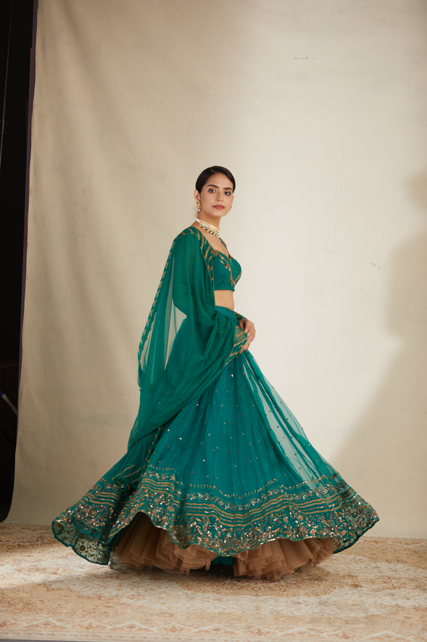 TEAL GREEN ANTIQUE SEQUENCE WORK LEHENGA SET