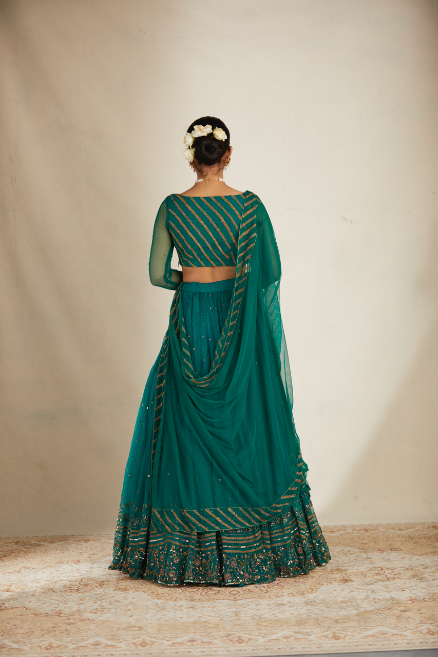 TEAL GREEN ANTIQUE SEQUENCE WORK LEHENGA SET