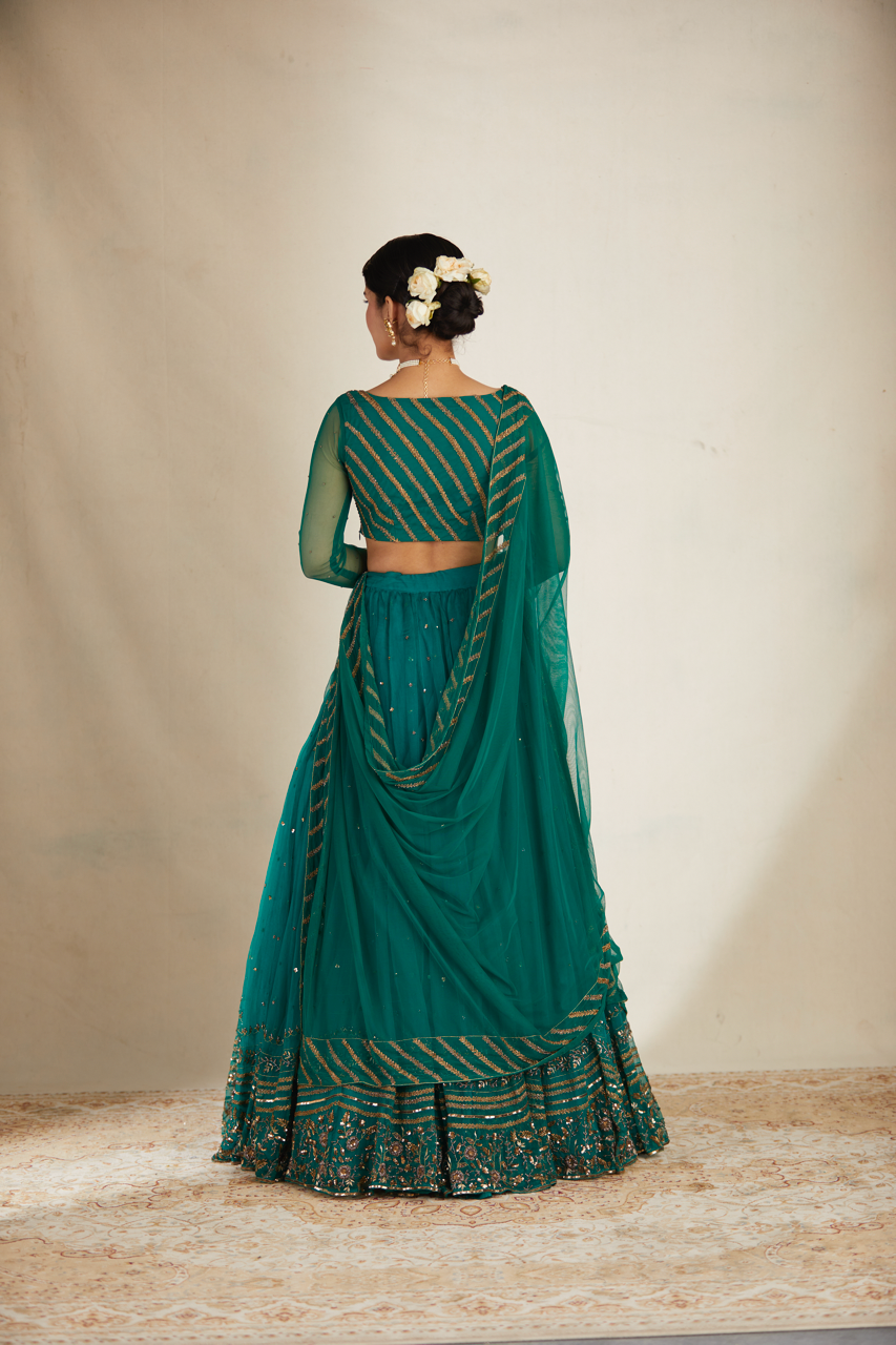 TEAL GREEN ANTIQUE SEQUENCE WORK LEHENGA SET
