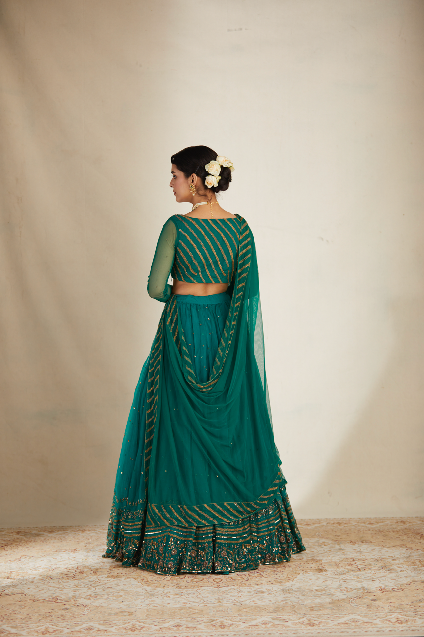 TEAL GREEN ANTIQUE SEQUENCE WORK LEHENGA SET