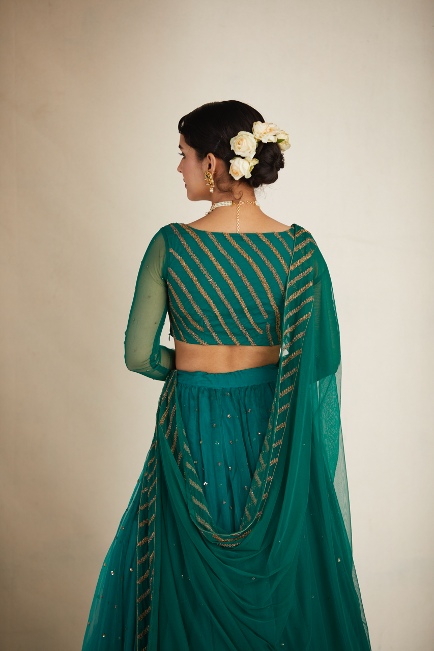 TEAL GREEN ANTIQUE SEQUENCE WORK LEHENGA SET