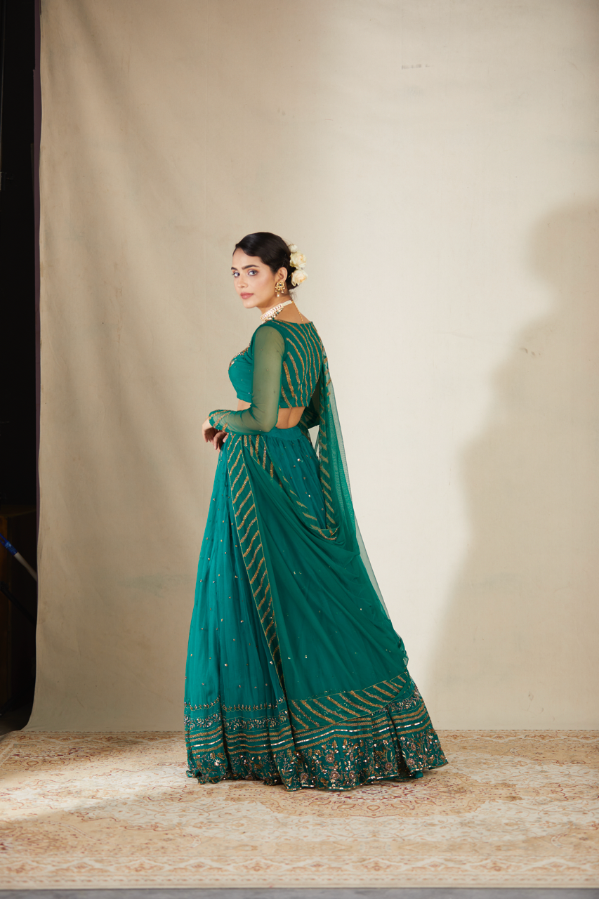 TEAL GREEN ANTIQUE SEQUENCE WORK LEHENGA SET