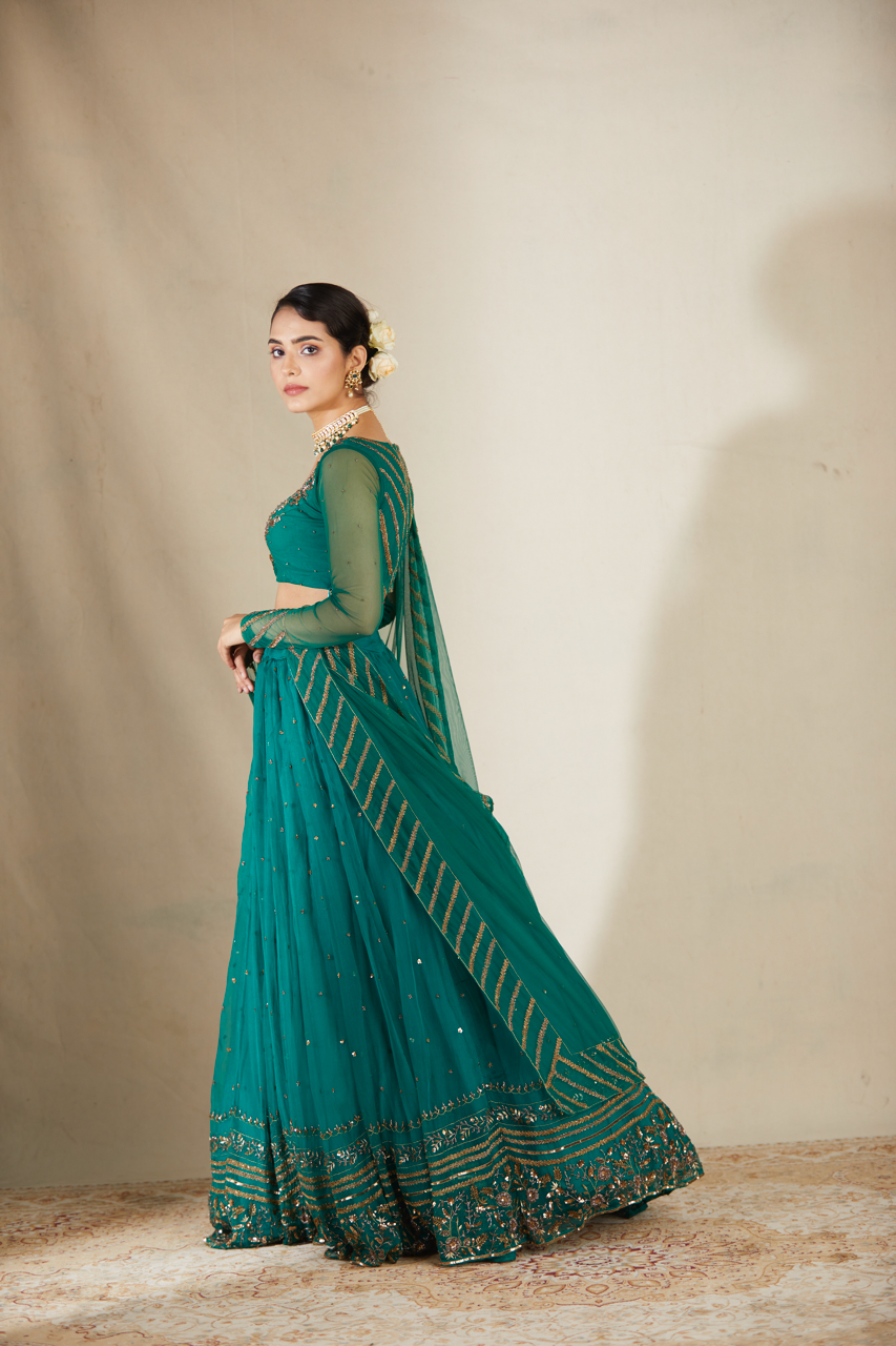 TEAL GREEN ANTIQUE SEQUENCE WORK LEHENGA SET
