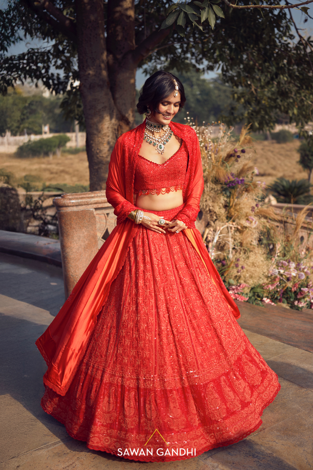 THE ORANGE-RED CHIKANKARI LEHENGA