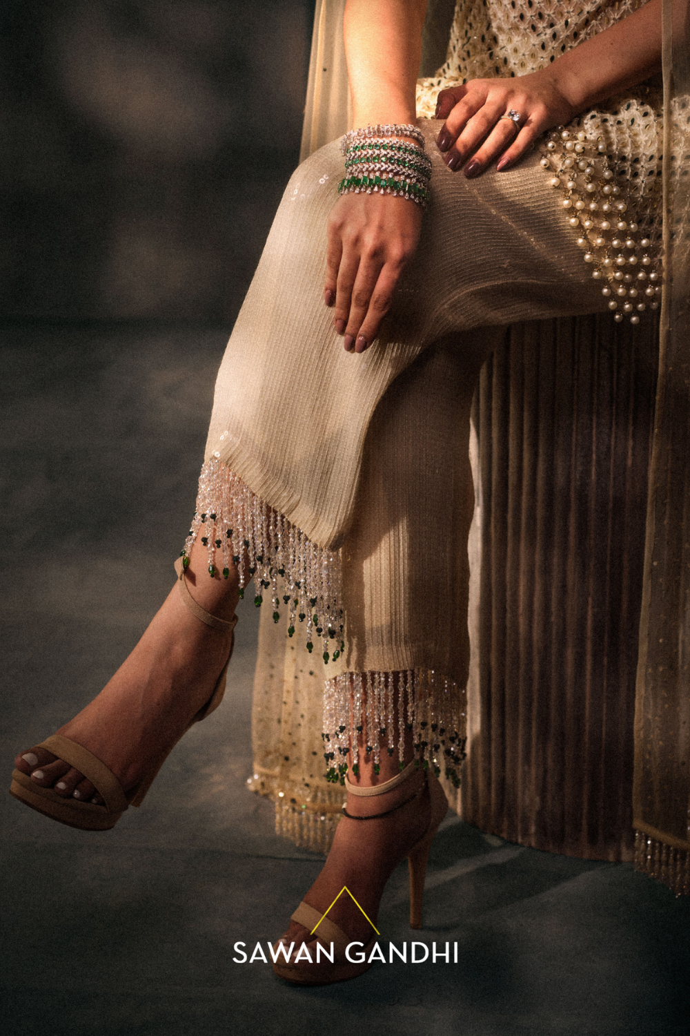 Ivory pearl tassel suit.