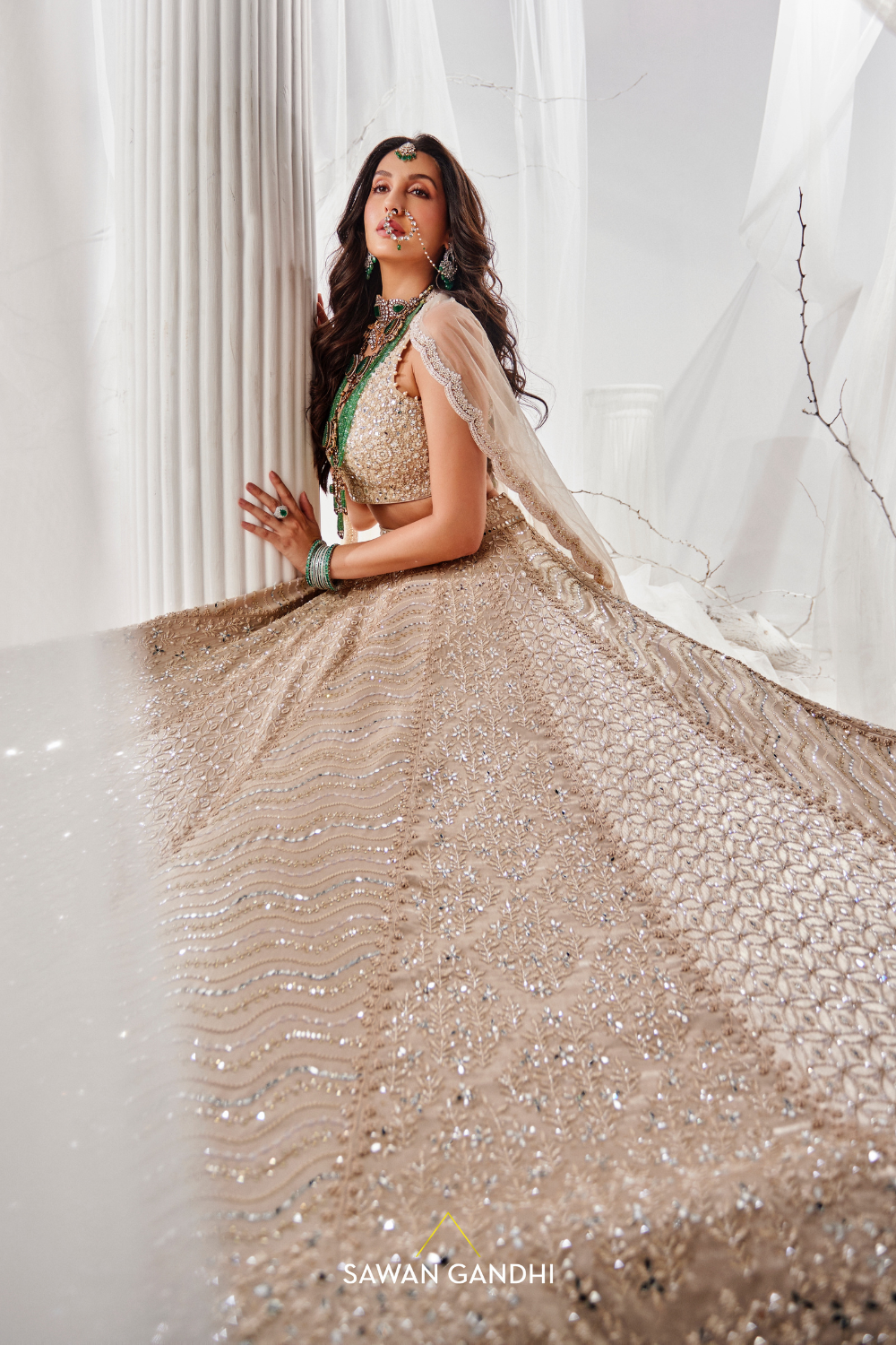 Nora Fatehi in Gold beige beadwork lehenga