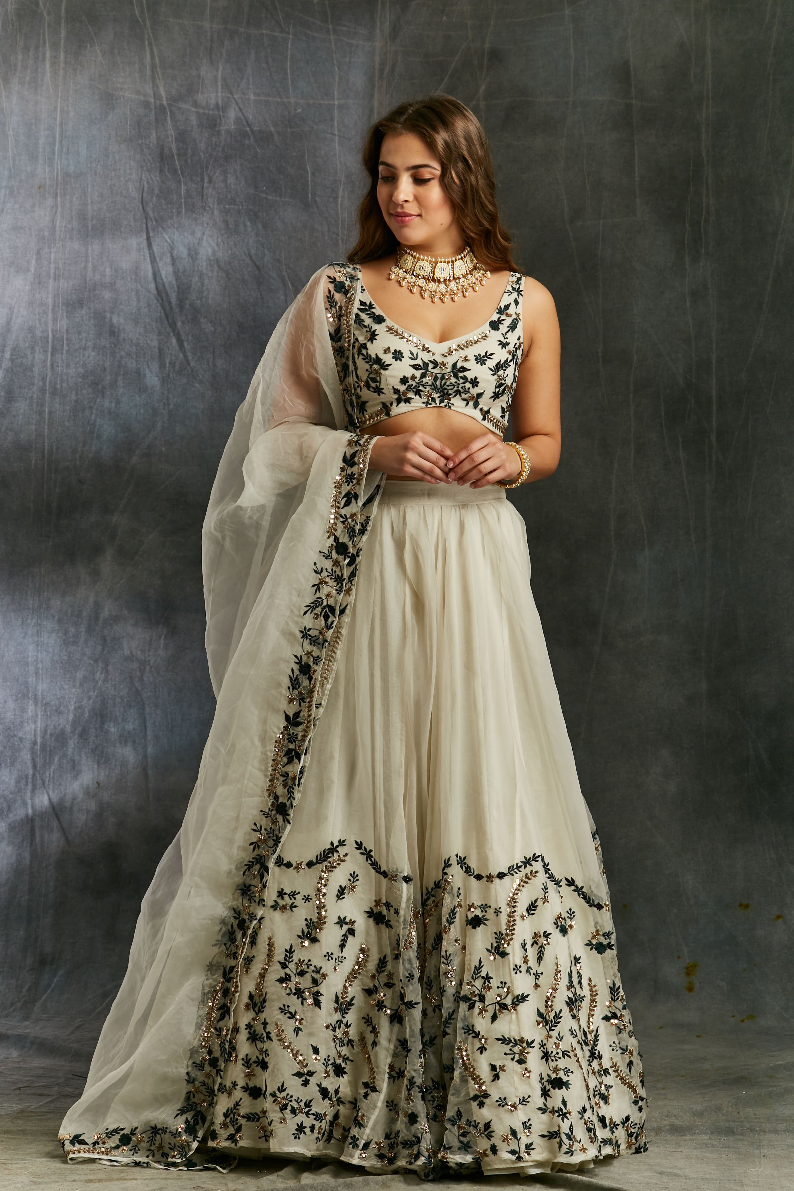 White Organza With Green And Black Threadwork Lehenga